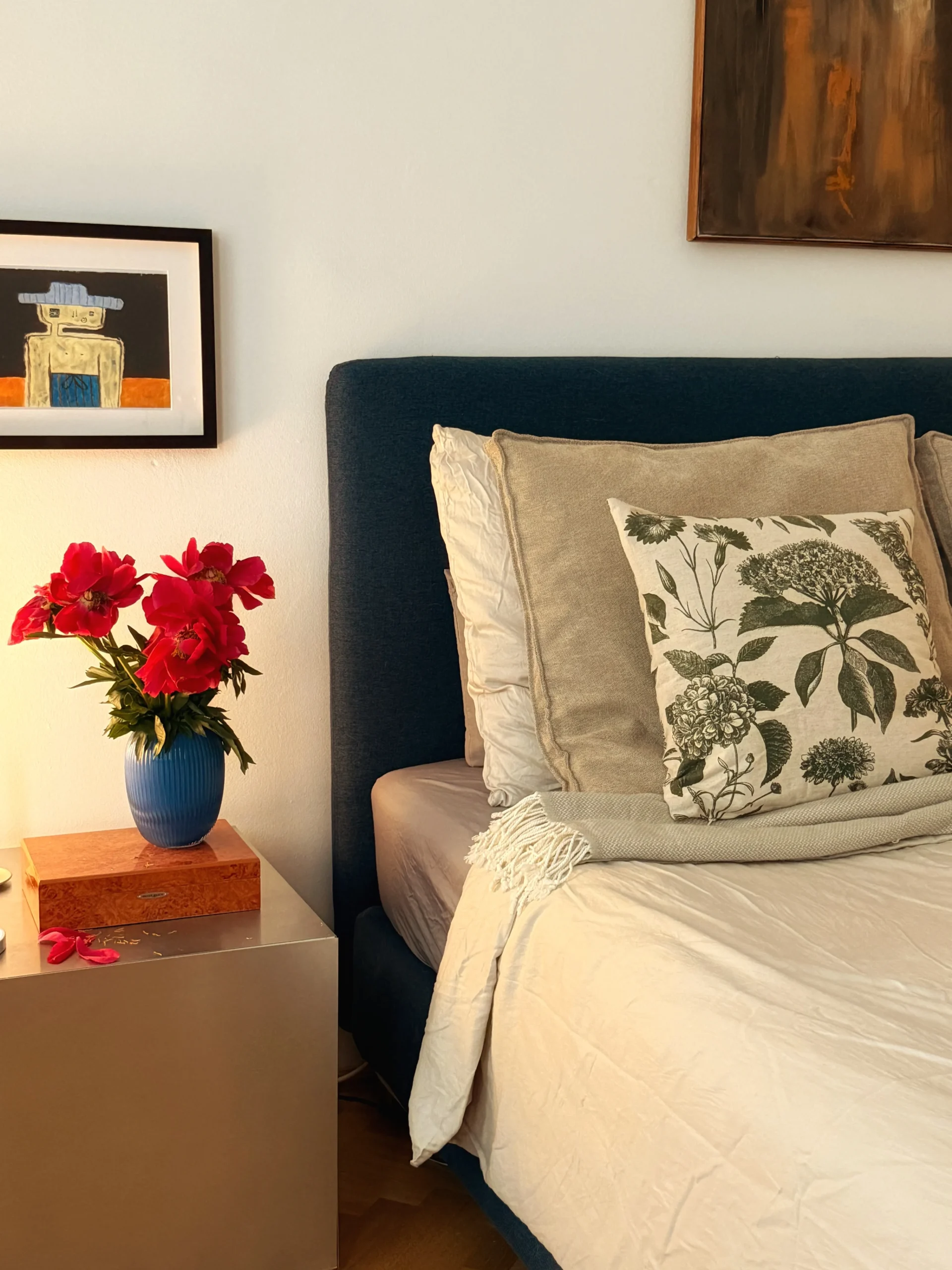 Cozy bedroom with flowers and art